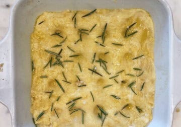 The dough was sprayed with olive oil and topped with rosemary leaves and salt.