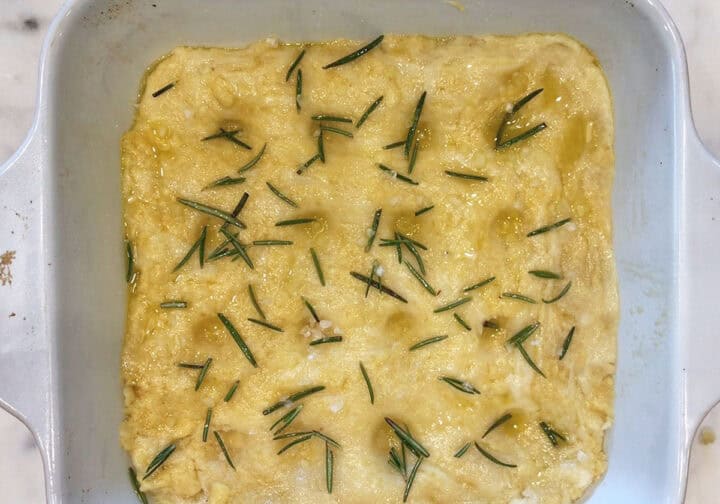 The dough was sprayed with olive oil and topped with rosemary leaves and salt.