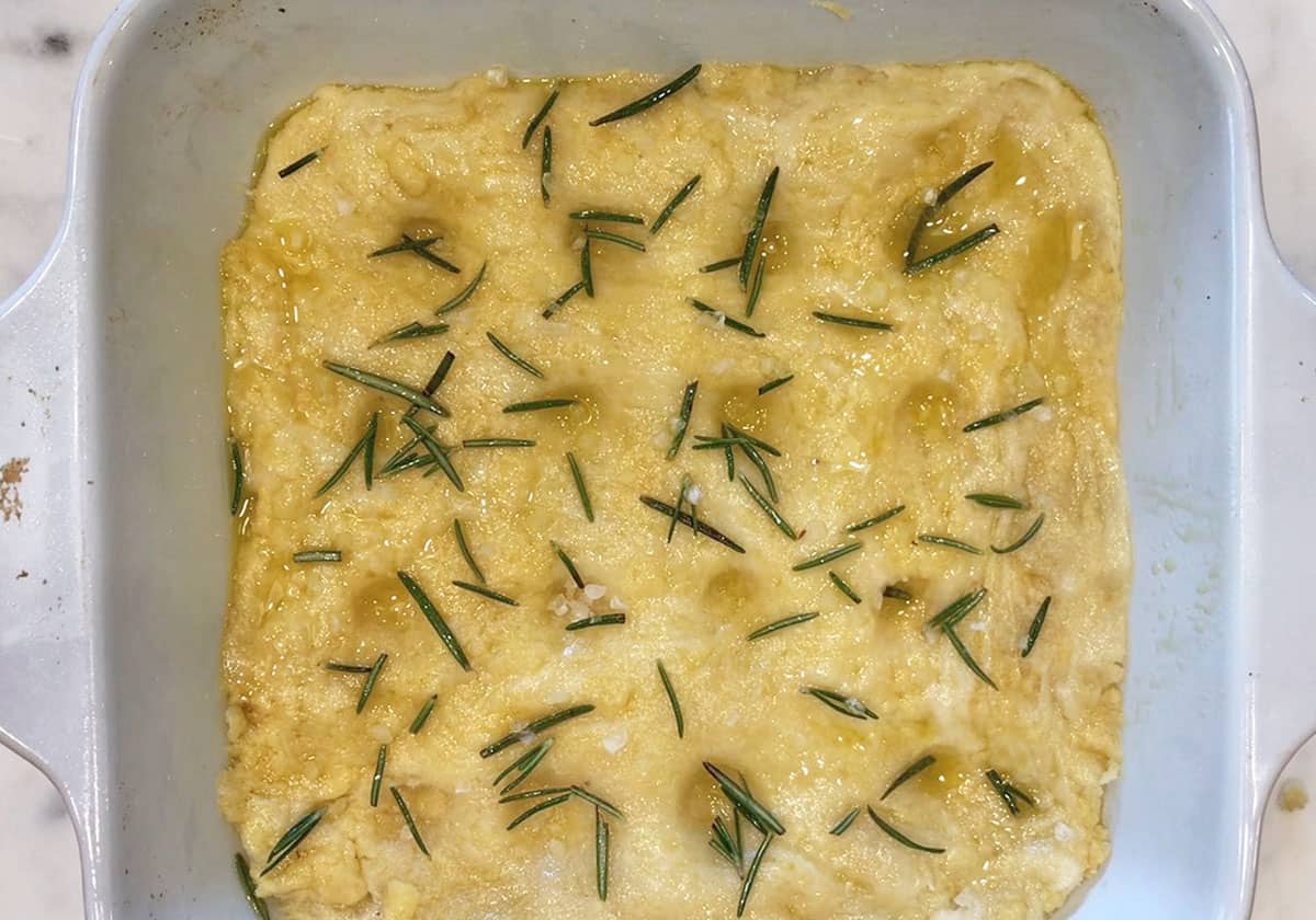 The dough was sprayed with olive oil and topped with rosemary leaves and salt.