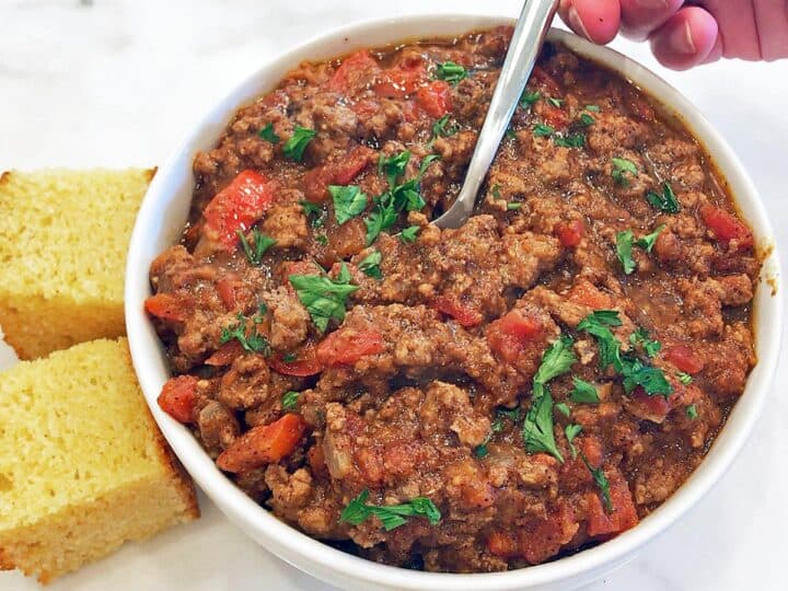 The chili is served with cornbread.