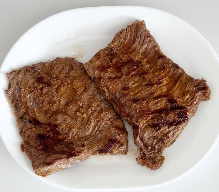 Resting the steak after grilling.
