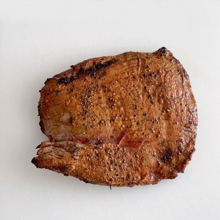 Resting the steak before slicing it.