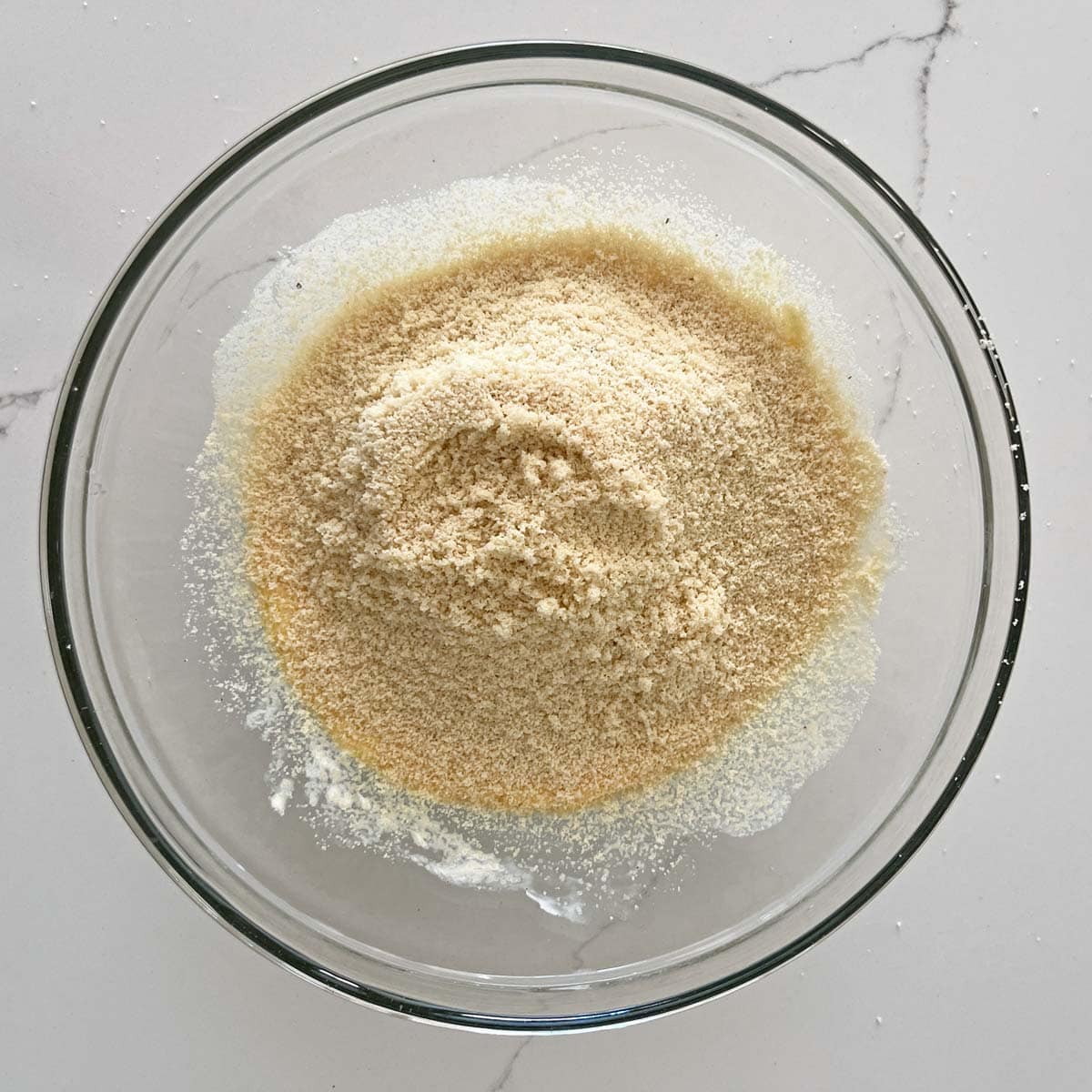 Sifted almond flour in a bowl.
