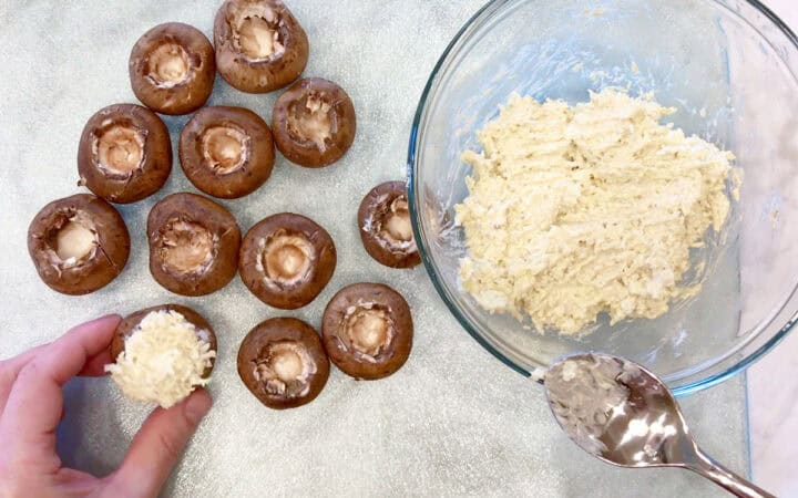 Stuffing the mushrooms.