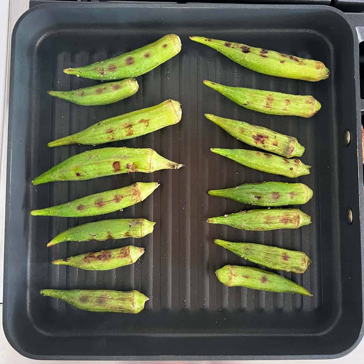 The okra was turned to the other side in the grill pan.