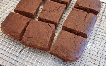 The cake was sliced. The slices are on a cooling rack.