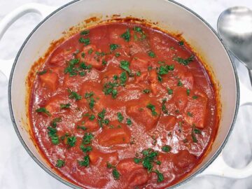 The stew is served with a spoon.