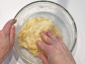 Kneading the dough in a bowl.