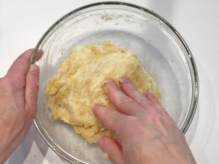 Kneading the dough in a bowl.
