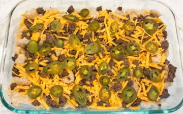 The nachos are ready for the oven.