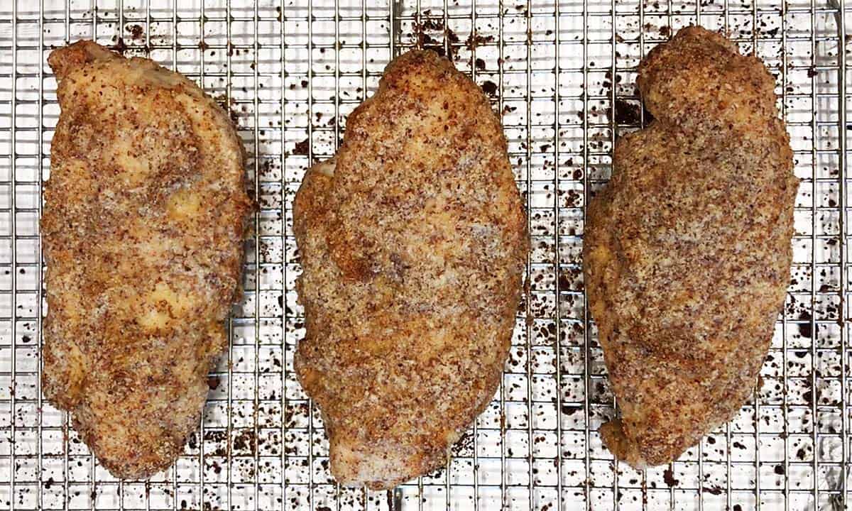 The chicken is on the pan and ready for the toppings.