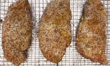 The coated chicken is ready for the oven.