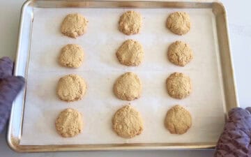 The cookies are fully baked in the pan.