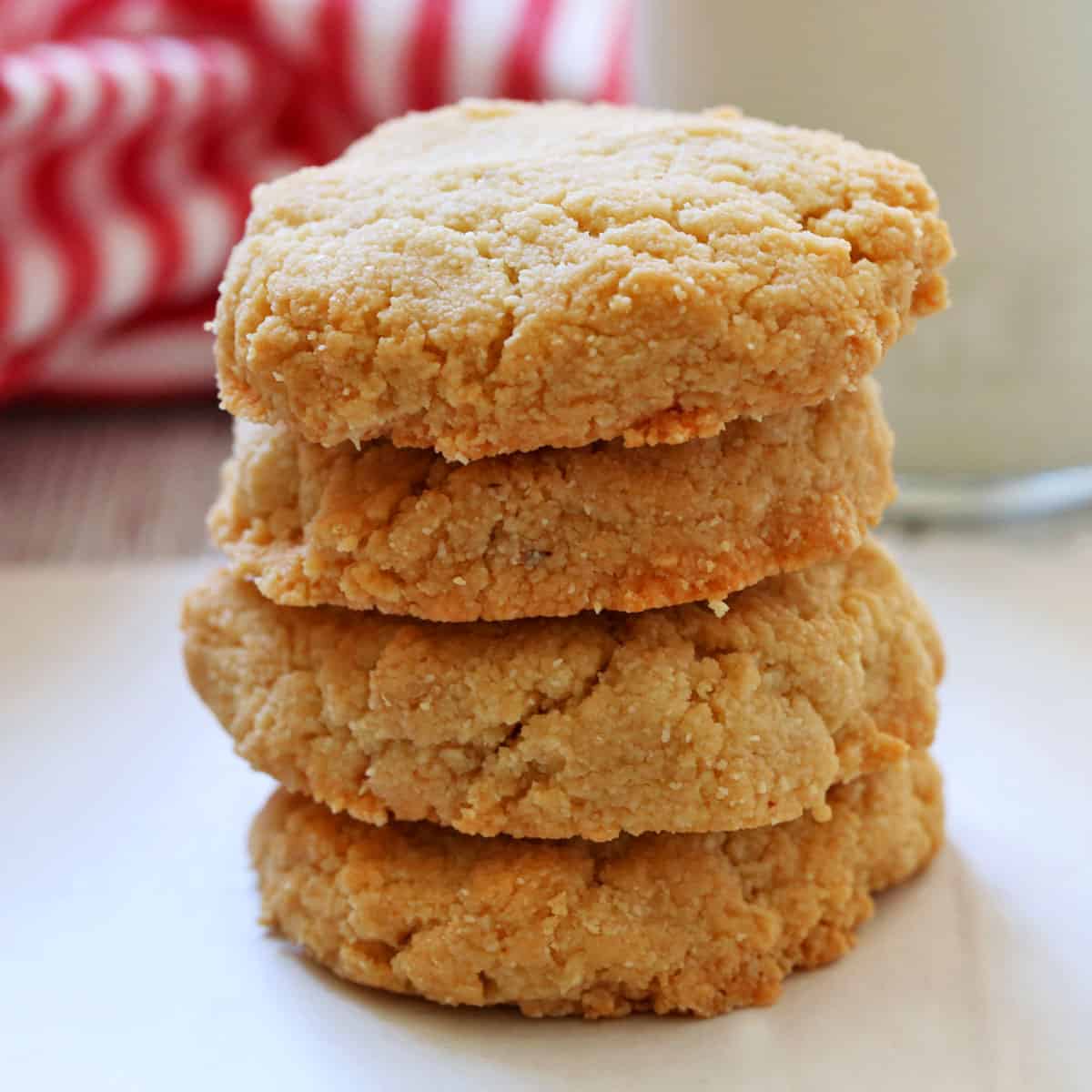 Keto shortbread cookies are stacked on a plate.