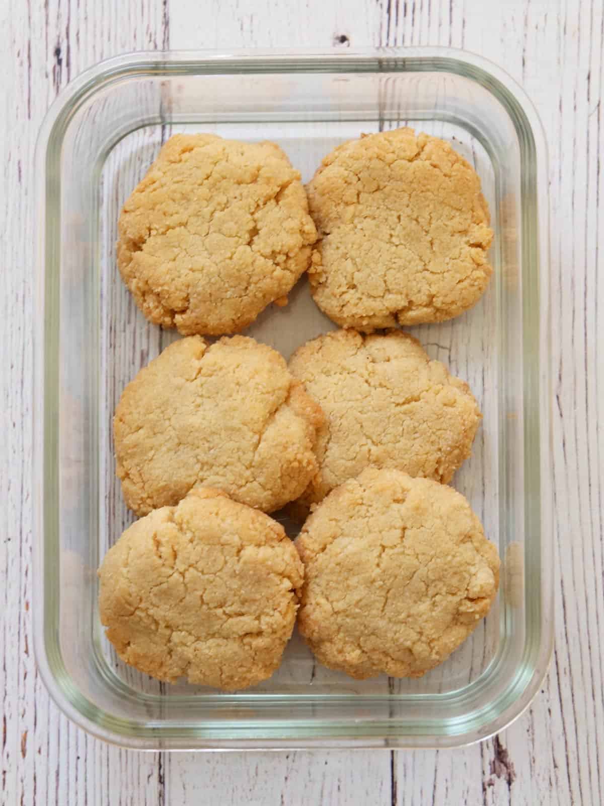 Leftover cookies are stored in a glass container.