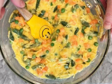 Mixing the quiche ingredients in a bowl.