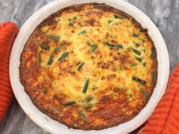 The quiche is ready and was pulled out of the oven.