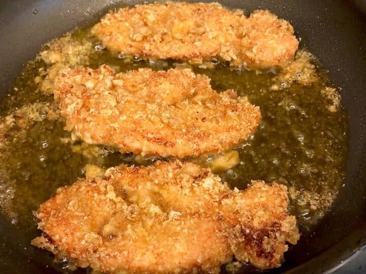 Cooking the tenders in a skillet.