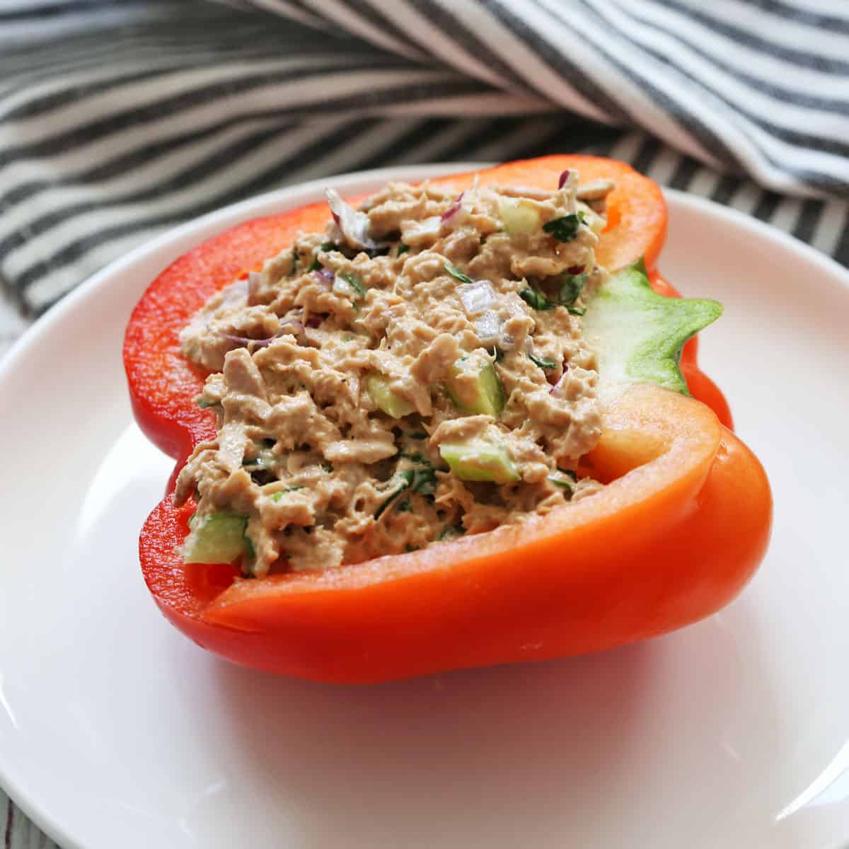 Half a bell pepper is stuffed with tuna salad.