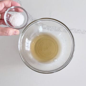 Adding salt to the vinegar.