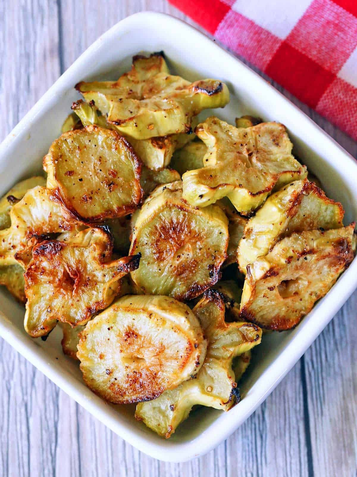 Broccoli stems are served in a white bowl.