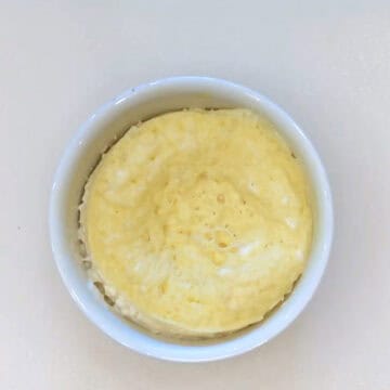 The cake in the ramekin after microwaving.