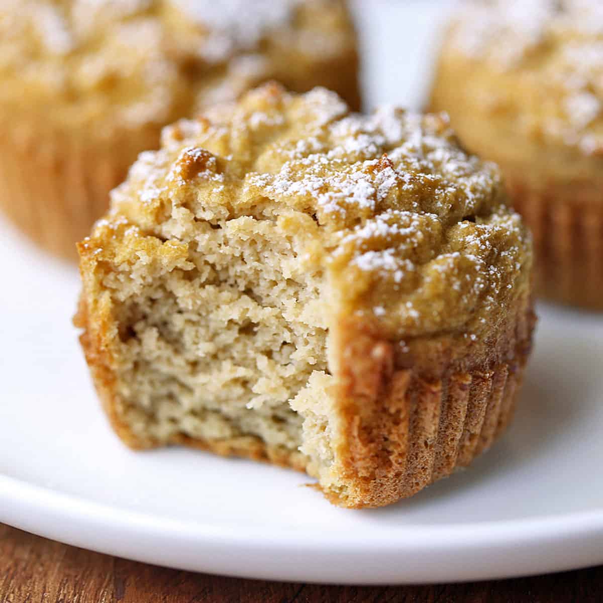 Coconut flour muffins are served on a white plate.