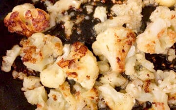 Cooking the cauliflower until it's browned.