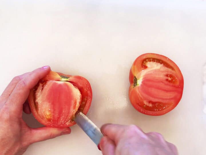 Hulling the tomatoes.