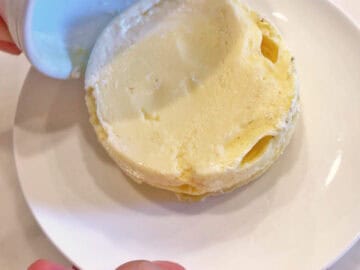 Inverting the cake onto a plate.