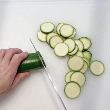 Slicing the zucchini.