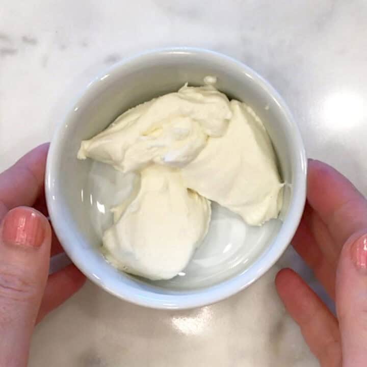 Softened cream cheese in a ramekin.