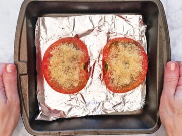 The tomatoes were topped with parmesan.