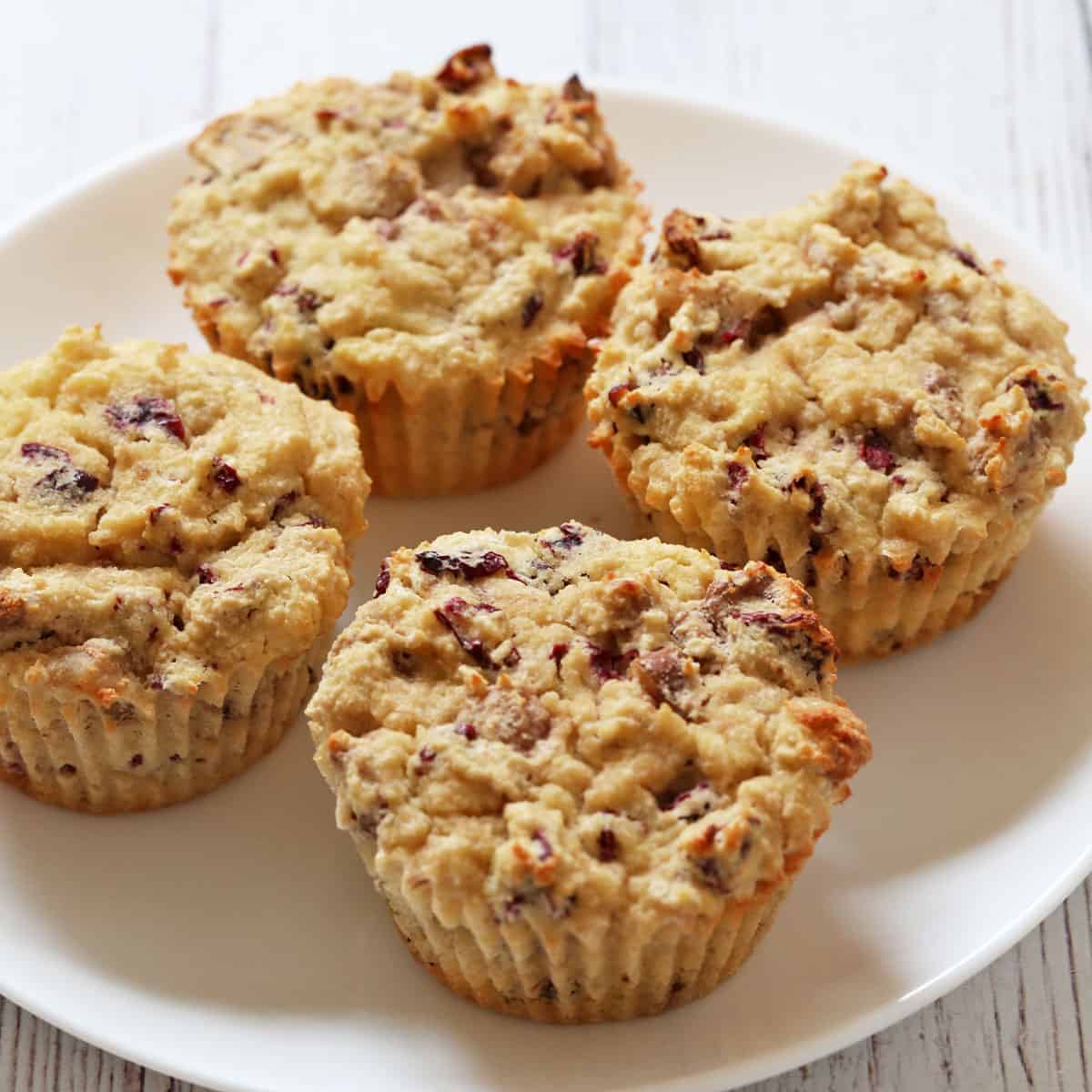 Coconut flour muffins with chopped nuts and dried cranberries.