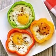 Bell pepper eggs are served on a white plate.