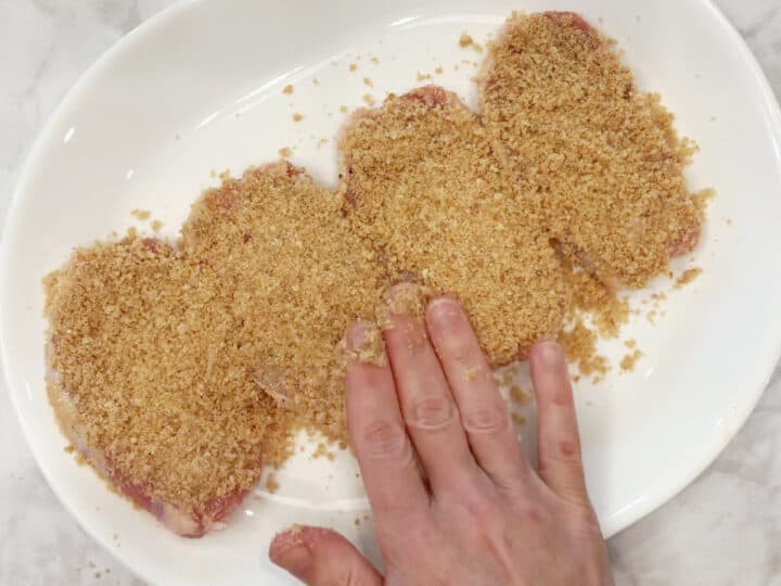 Coating the chops in pork panko.