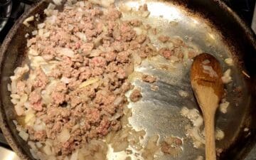Cooking ground beef and onions.