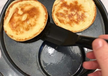 Flipping the pancakes.