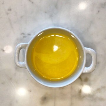 Melted butter in a ramekin.