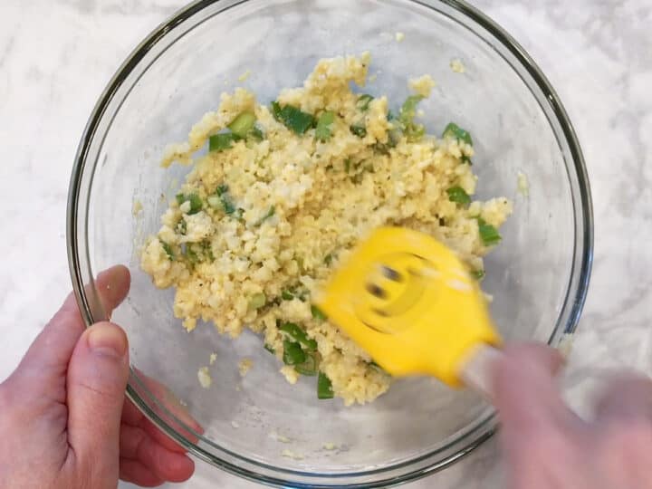 Mixing the ingredients in a bowl.