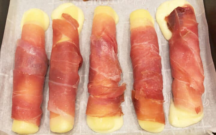 The cheese sticks are fully baked and ready in the pan.