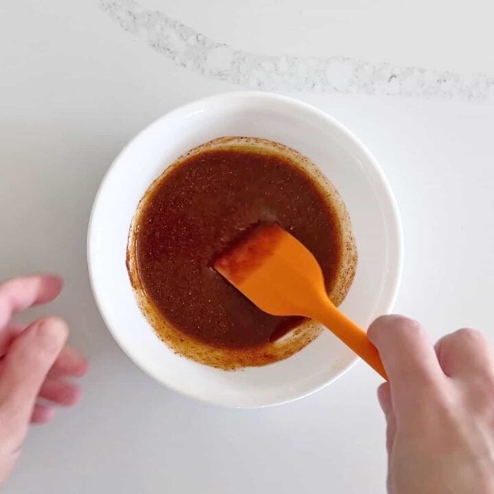 Mixing the seasoning paste in a bowl.