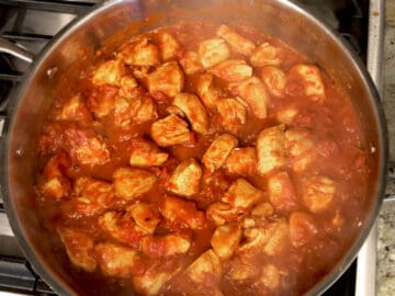 The tomato sauce was added to the skillet.