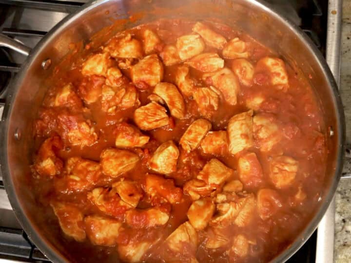 The tomato sauce was added to the skillet.