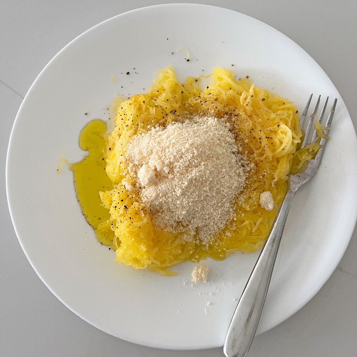 The squash was topped with olive oil, parmesan, and spices.