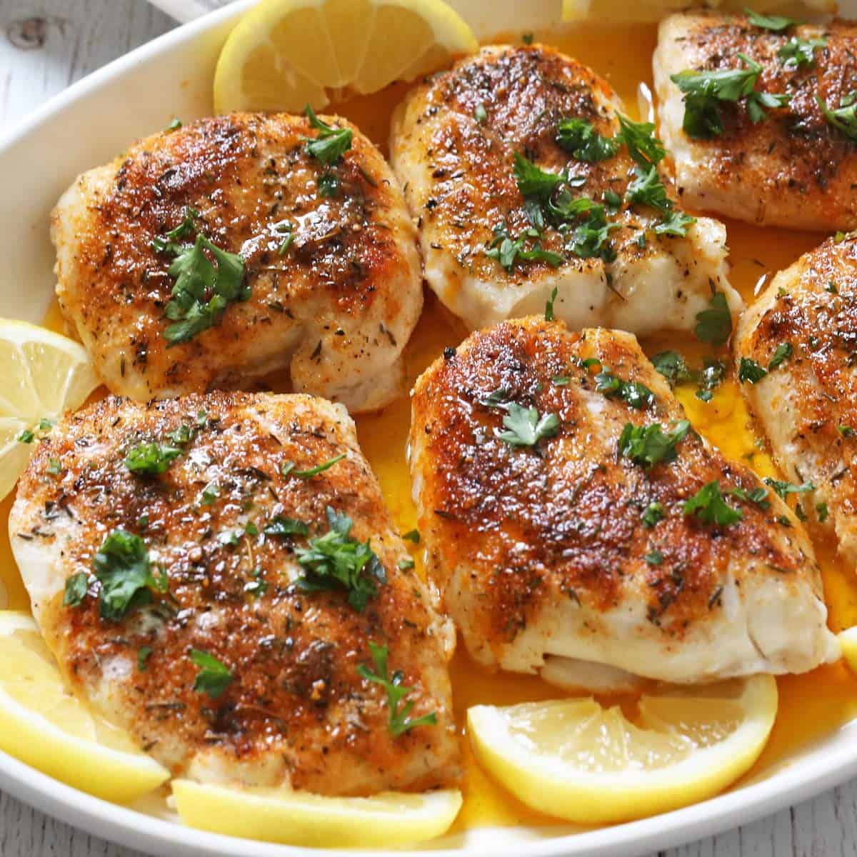 White fish fillets are served in a baking dish.