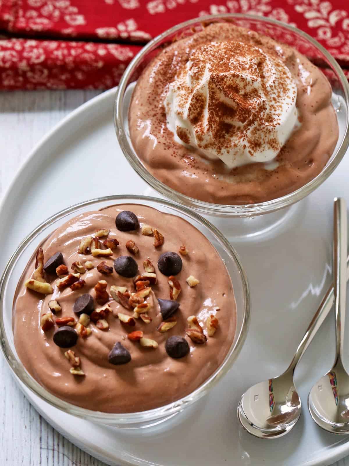 cottage cheese chocolate mousse topped with whipped cream, nuts, and chocolate chips.