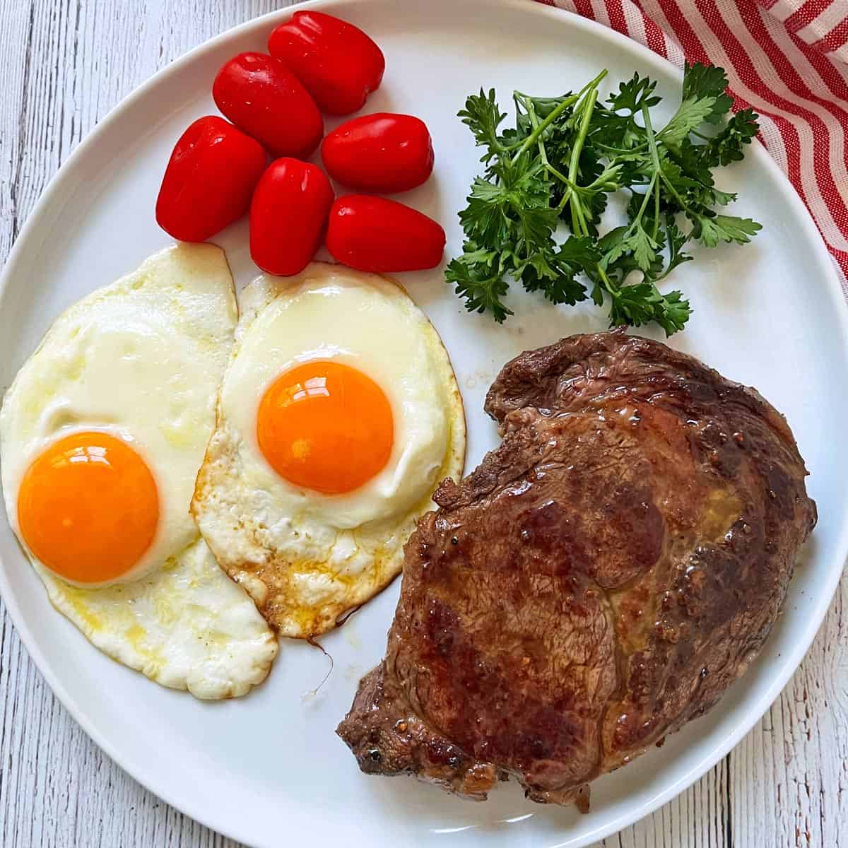 A steak and eggs meal with ribeye steak.