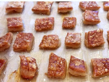 The pork rinds are ready on the baking sheet.