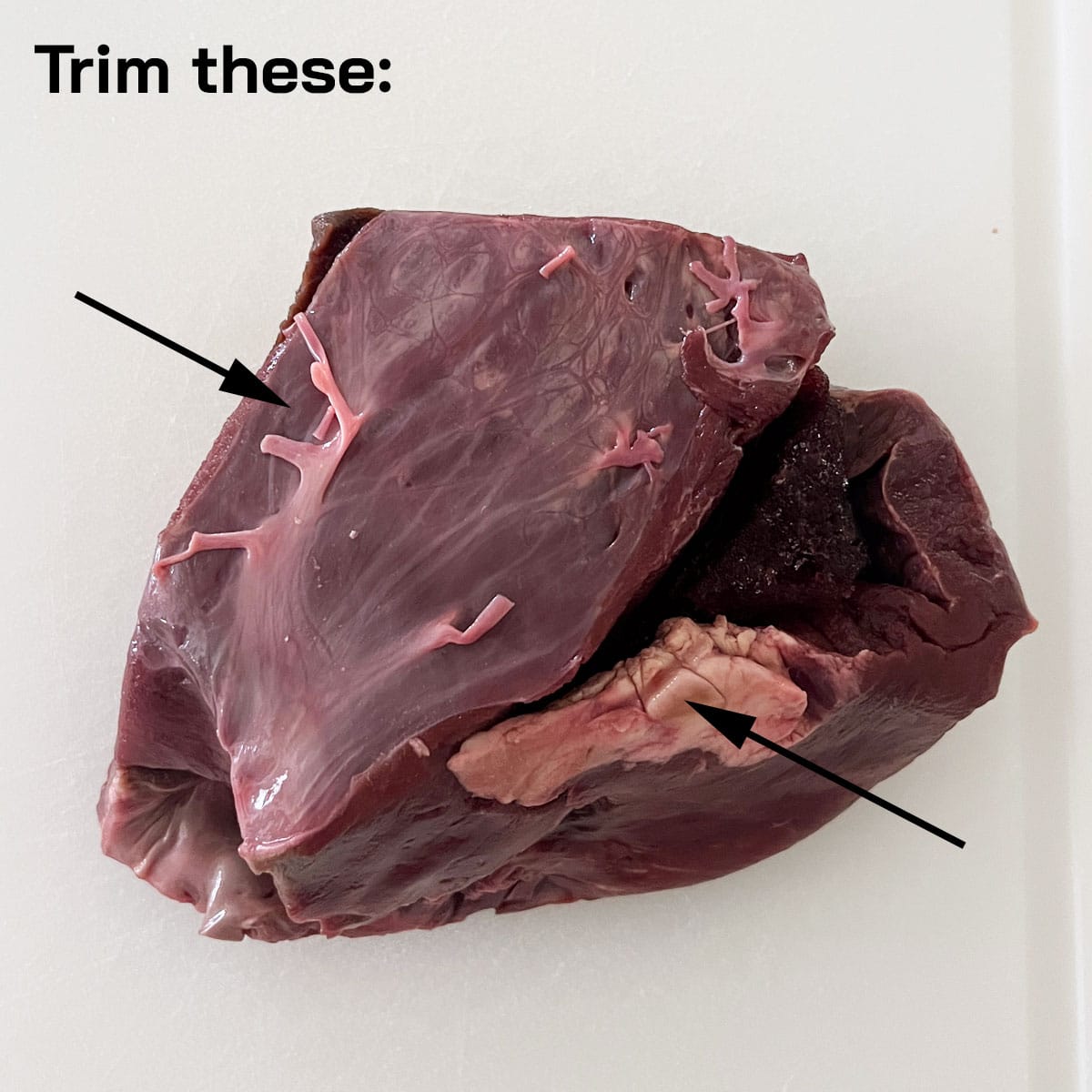 Trimming beef heart.
